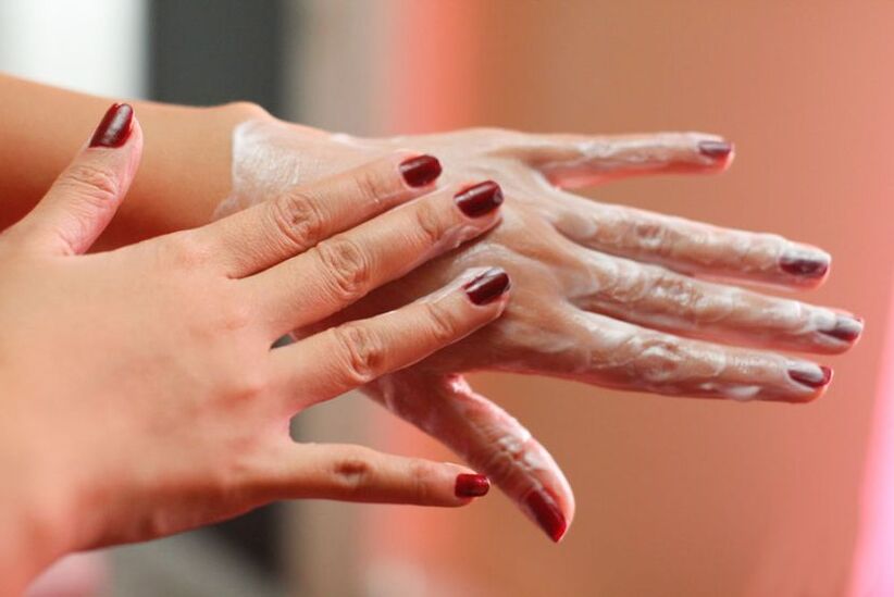 Apply cream on hands to restore skin vitality